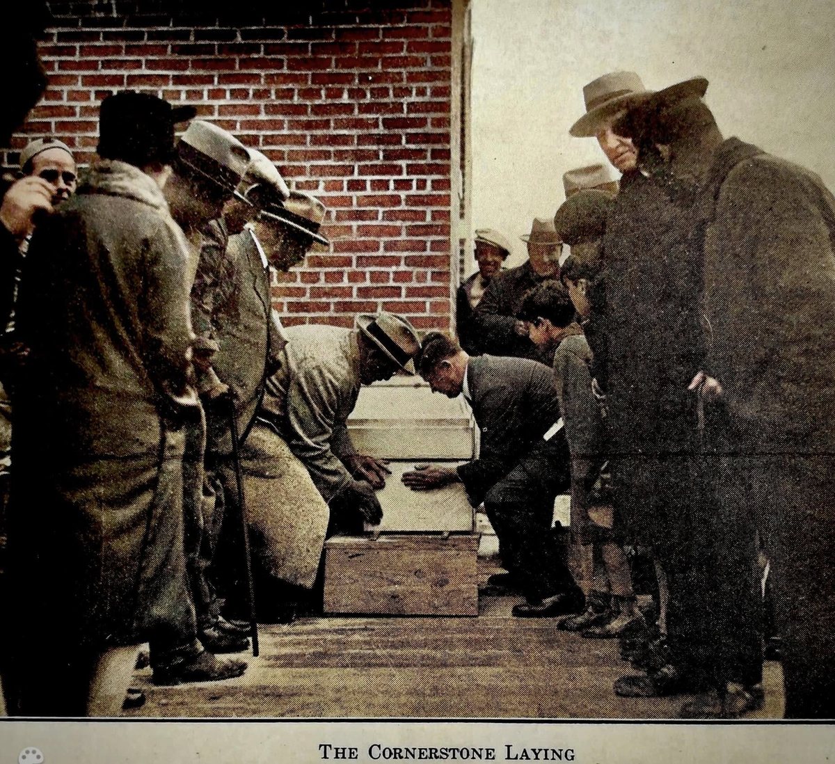 Members gathered for the laying of the building's cornerstone