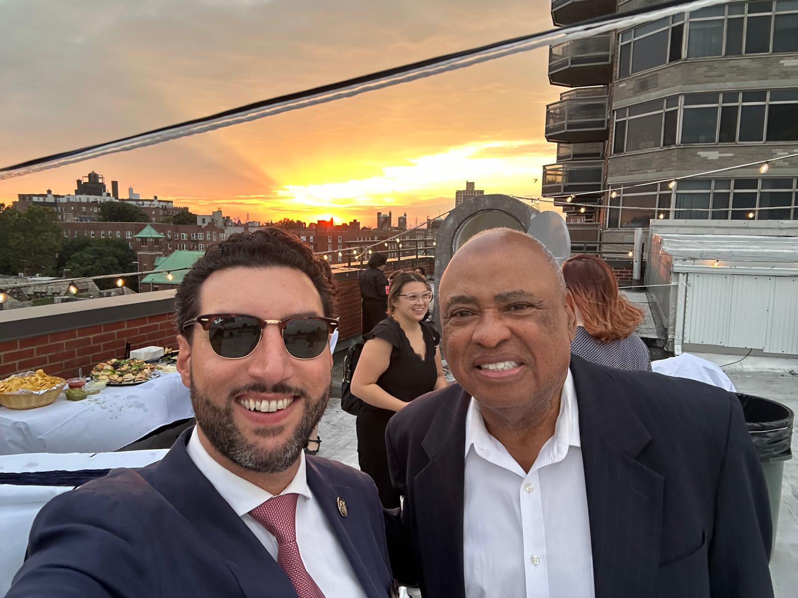 MSCQ members at a rooftop event at sunset